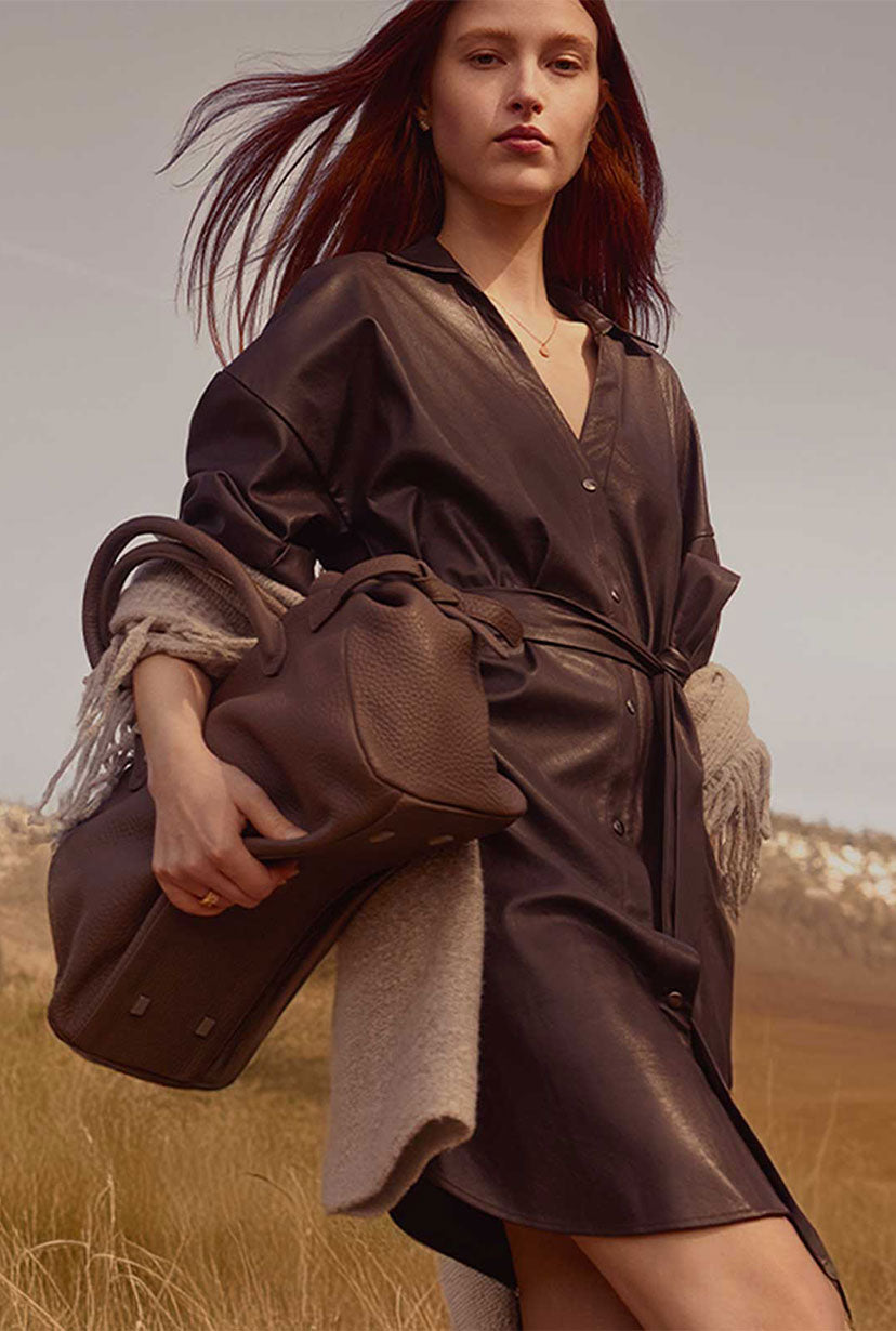 model carrying brochu walker brown handbag