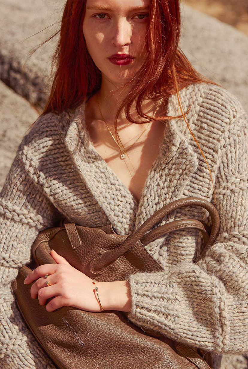 model on a beach waering BW chic jewelry