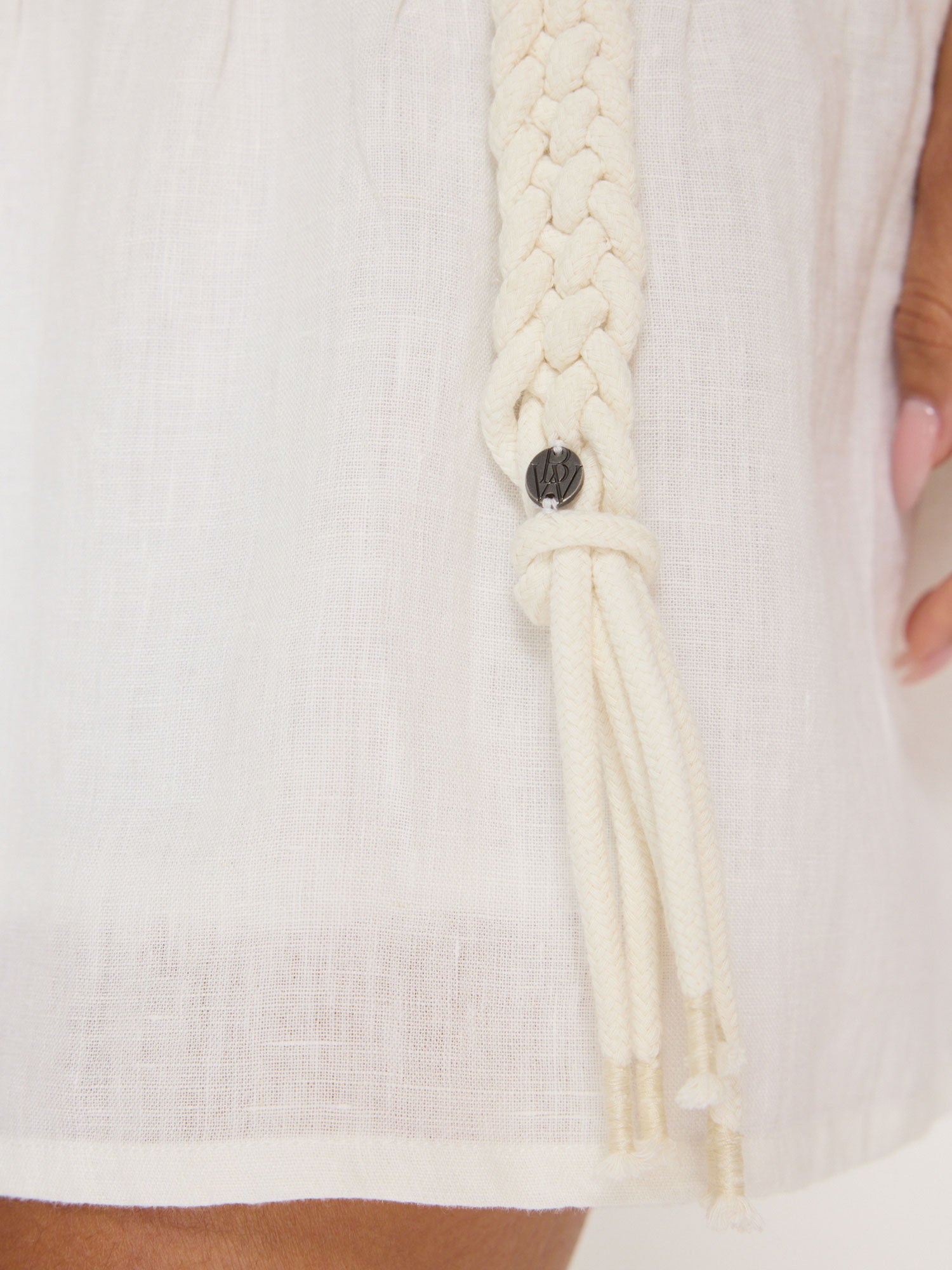 Macrame natural cotton belt coiled close up