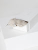 Ribbed cashmere socks in mist mélange folded on a white Brochu Walker gift box.