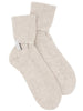 Pair of ribbed cashmere socks in mist mélange ivory with folded cuffs and cinched ankles.