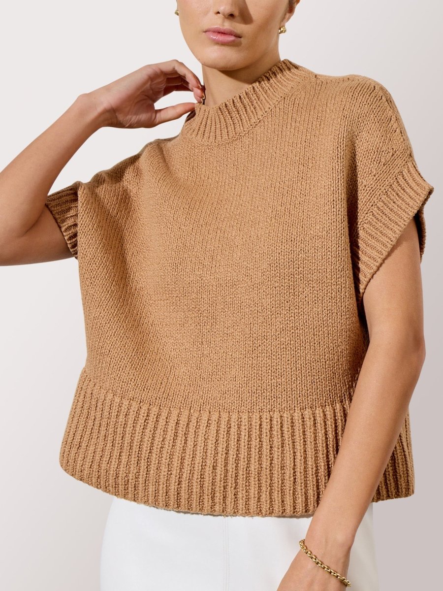 Women's camel sweater with short sleeves, mock neck, and wide ribbed hem for a cozy, structured silhouette.