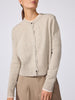 Front view of the Archie layered cardigan in gravel stone melange, showing the button-front closure and ribbed cuffs with beige trousers.