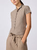Close-up of the Emmy cardigan in otter melange, a button-front knit top styled with matching tie-waist trousers