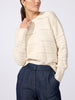 Woman wearing the Everyday multi-stitch bright crew sweater in oatmeal melange with dark blue trousers
