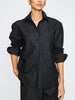 Women's denim button down shirt in dark indigo with a relaxed fit, front pocket, and rolled-up sleeves.