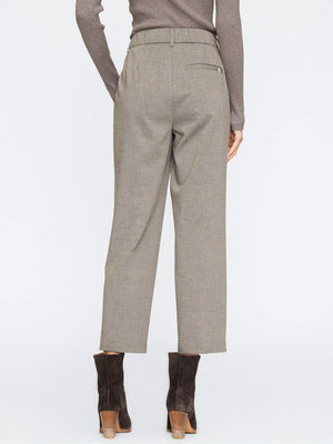 Formal pants for women with tailored seams and cropped hem, styled with dark suede ankle boots.