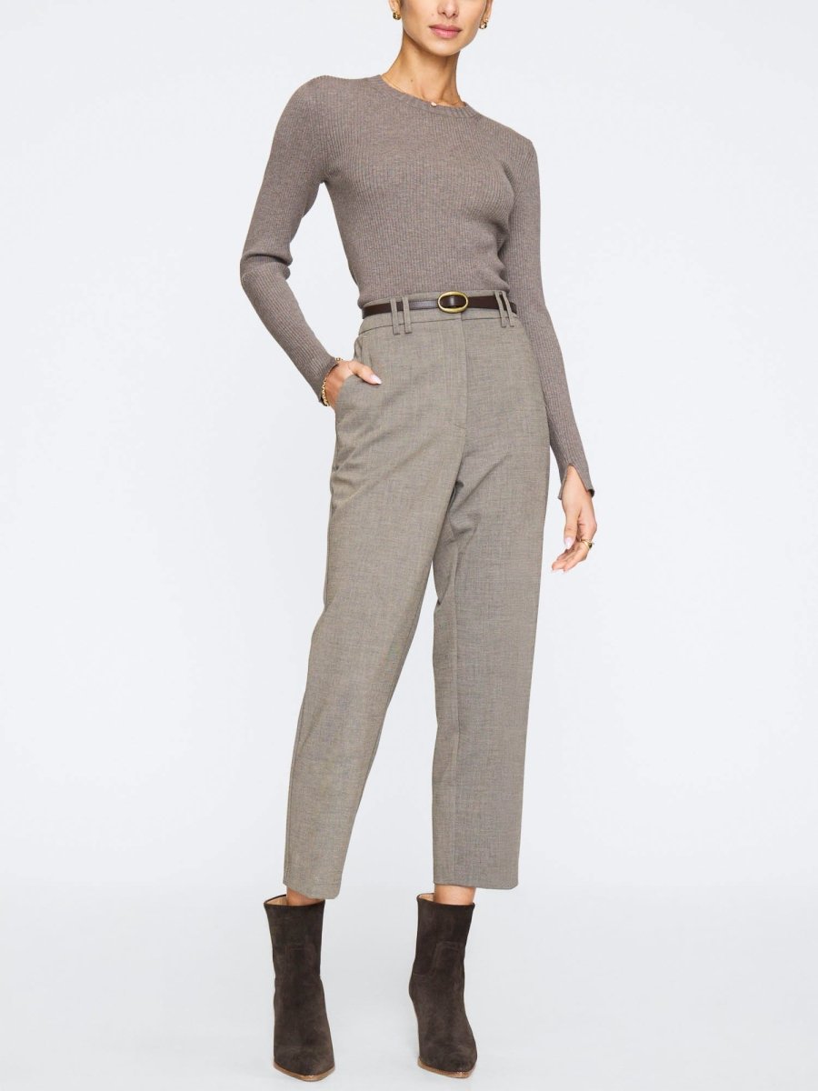 Women's formal pants in a slim straight-leg fit, styled with a brown belt and heeled suede ankle boots.