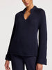 Women's long sleeve navy sweater in a thick knit with a split neckline, raglan sleeves, and turned-up cuffs for a structured, cozy look.