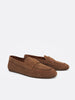 Angled view of a pair of tan suede loafers with low rubber soles on a white background.