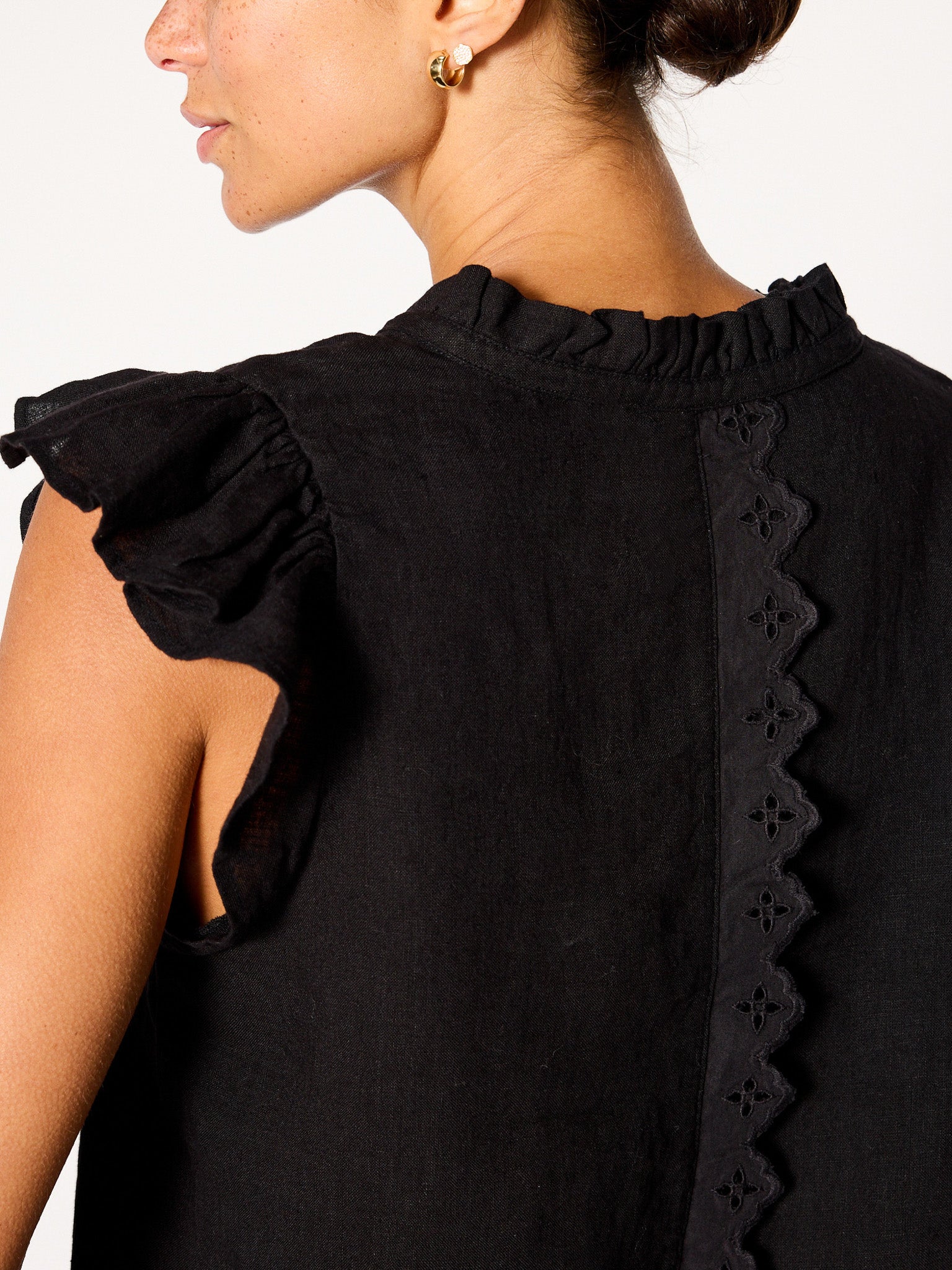 Devan black sleeveless linen v-neck eyelet blouse close up