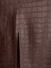 Vegan croco-embossed skirt in carob, close-up fabric detail with front slit