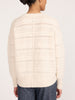 Back view of the Brochu Walker Everyday Multistitch Bright Crew sweater in Oatmeal Melange, an open-knit cream sweater paired with blue jeans.