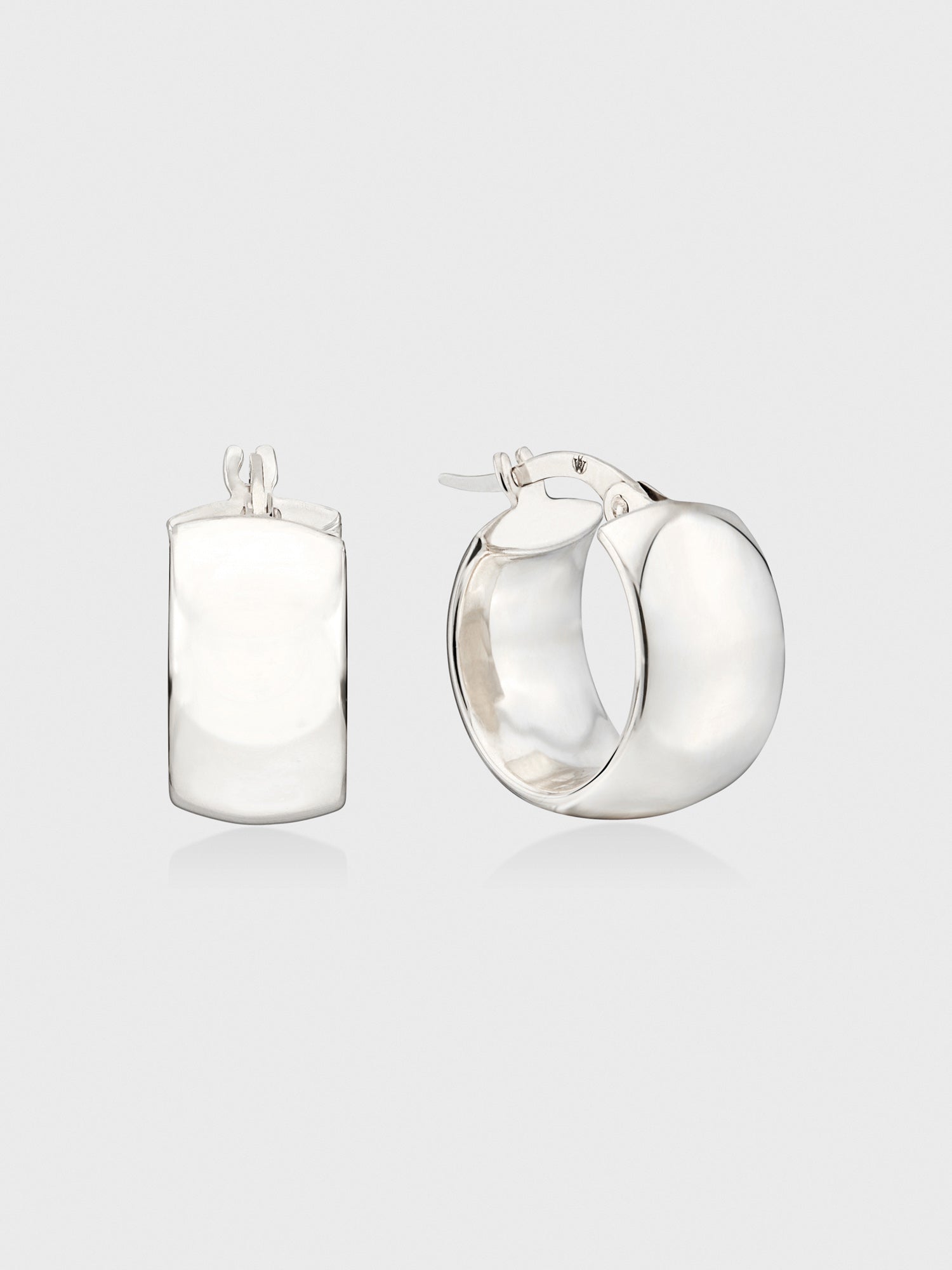 White gold mini hoop earrings shown from two angles, highlighting the polished chunky band