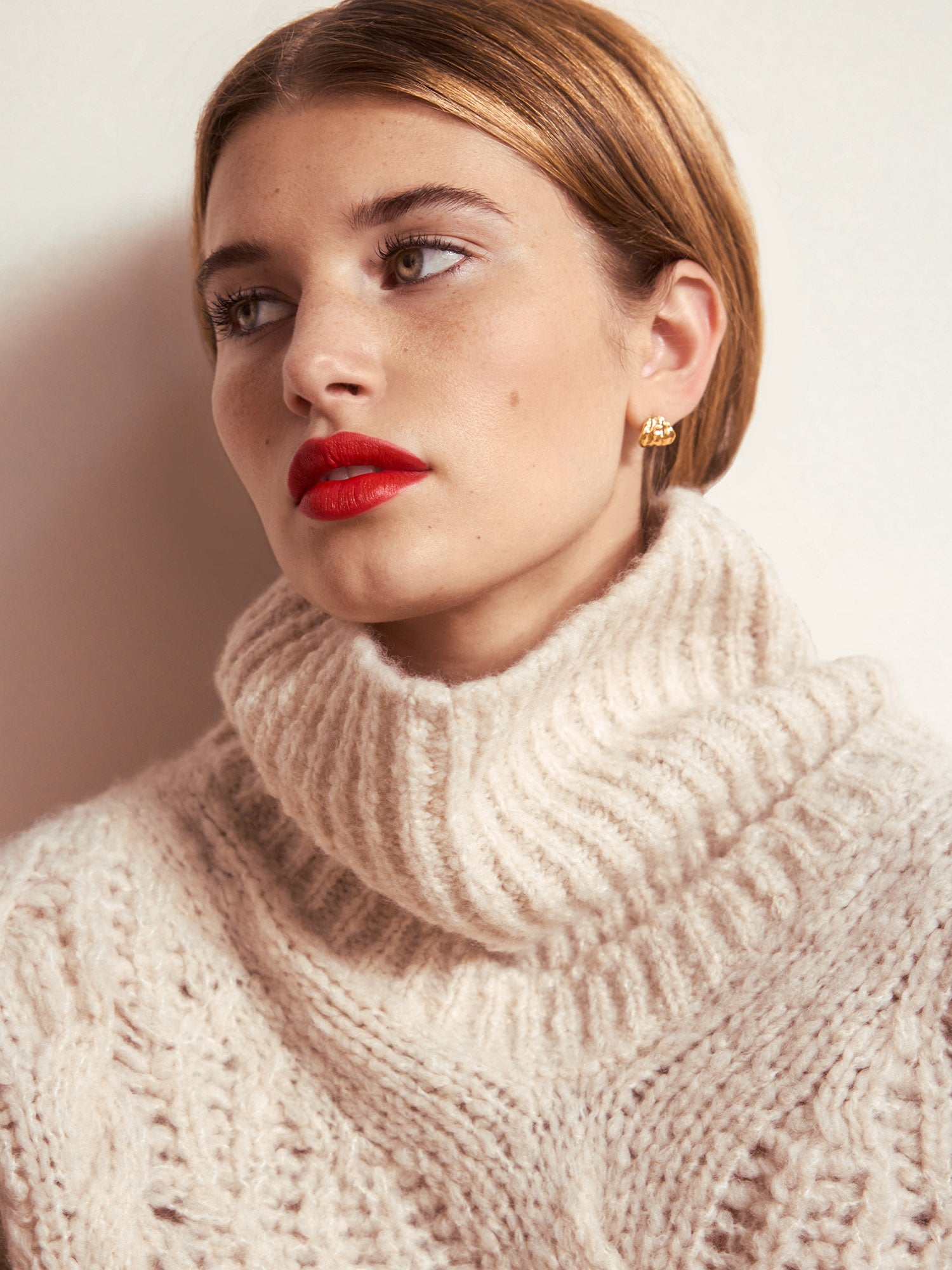 Elden cable knit beige turtleneck sweater close up