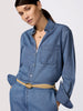 Classy denim dress with long sleeves, chest pocket, V-neckline, and tan belt shown in a close-up upper-body view.