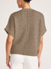 Back view of the bronze Gaia Metallic Tee, a boxy short sleeve sweater, styled with ivory women's pants.