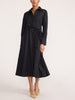 Front view of a women's black midi shirt dress with a tie waist and heels