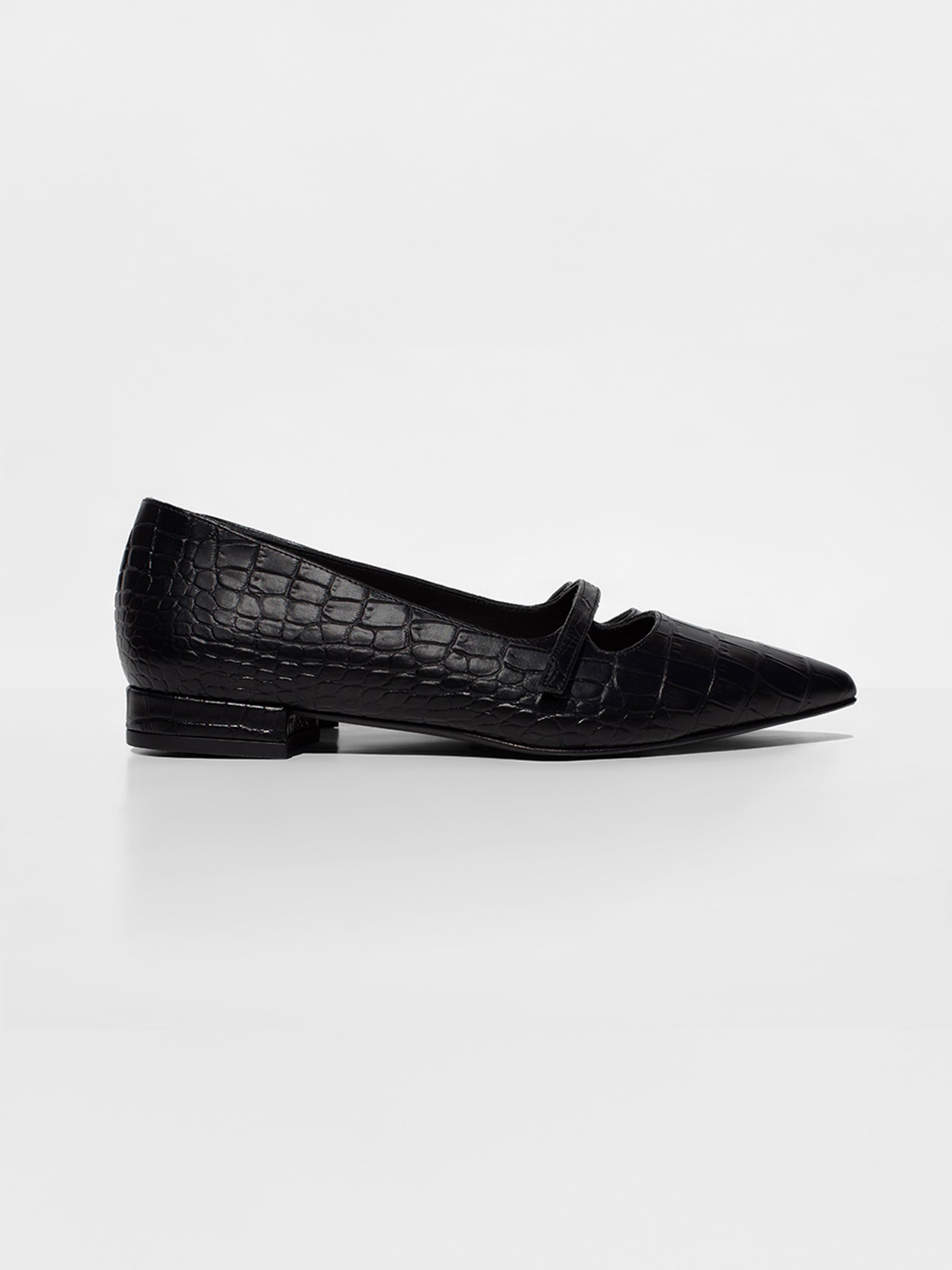 Side profile of a black croc-embossed Mary Jane flat with a pointed toe and low heel
