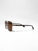 Gold-frame aviator sunglasses with brown lenses and tortoise temple tips, shown from the side