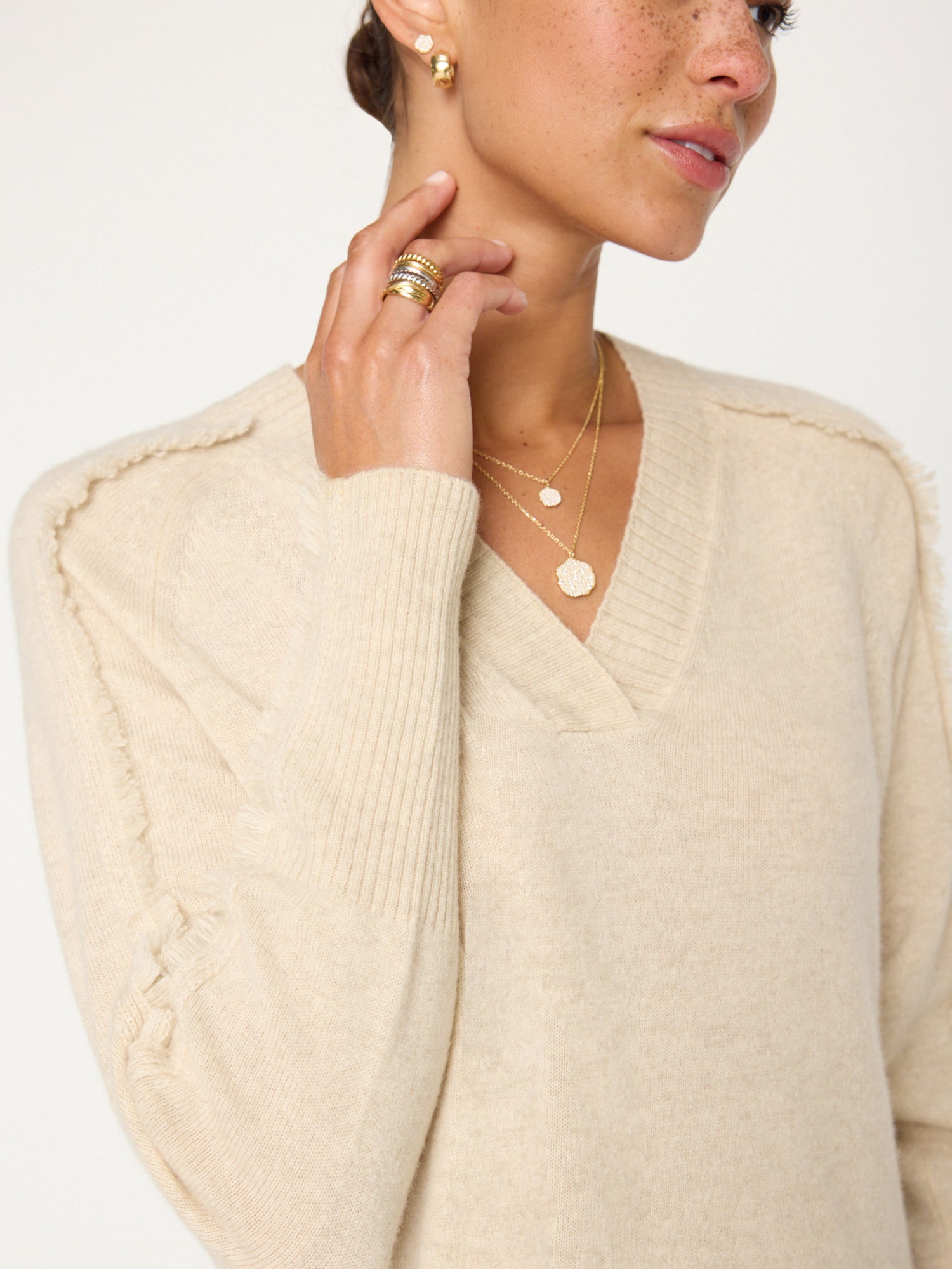 Jolie beige fringe trim v-neck sweater close up