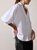 Kate shirt in salt white with voluminous puff sleeves, styled with black leather trousers