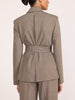 Belted blazer and trouser suit in gravel melange gray, back view showing tie-waist detail