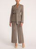Belted blazer and wide-leg trouser suit in gravel melange gray, tailored two-piece look with cropped trousers and beige heels