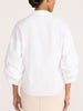 Milan white balloon-sleeve shirt in salt white, back view with beige pants