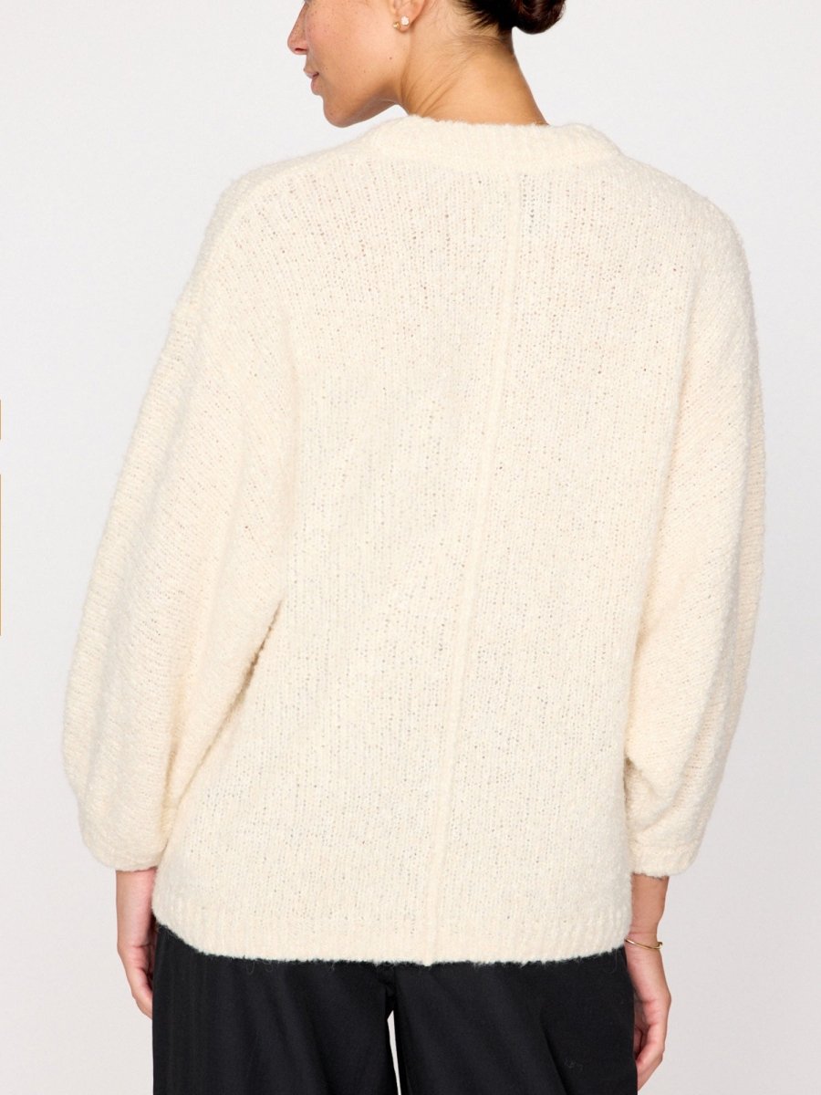 Malin ivory V-neck pullover sweater back view