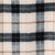Monclair plaid fabric swatch in cream, navy, and tan