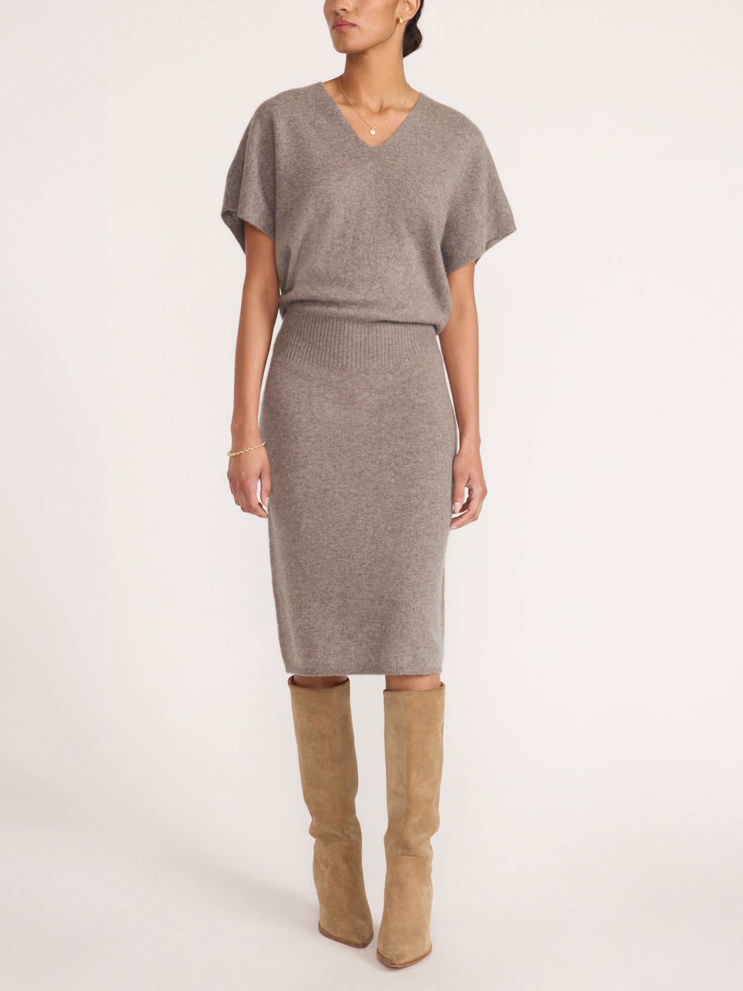 Ophi V-neck cashmere sweater dress in otter melange, studio shot with knee-high boots