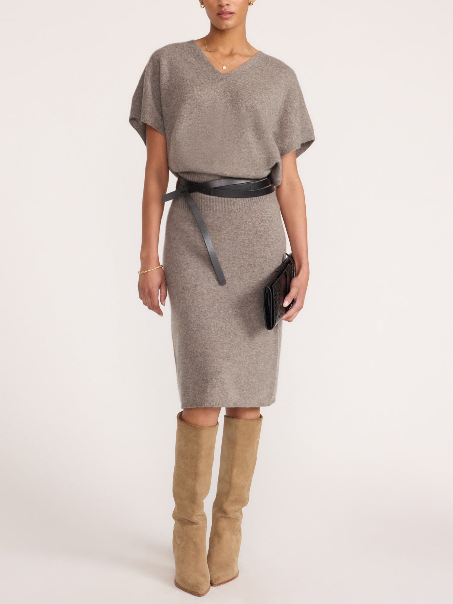 Ophi V-neck cashmere sweater dress in otter melange, styled with a black belt and suede over-the-knee boots