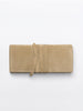 Beige suede clutch bag with a wrap-around tie strap