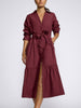 Model wearing a deep burgundy midi shirt dress with a tie waist and front slit
