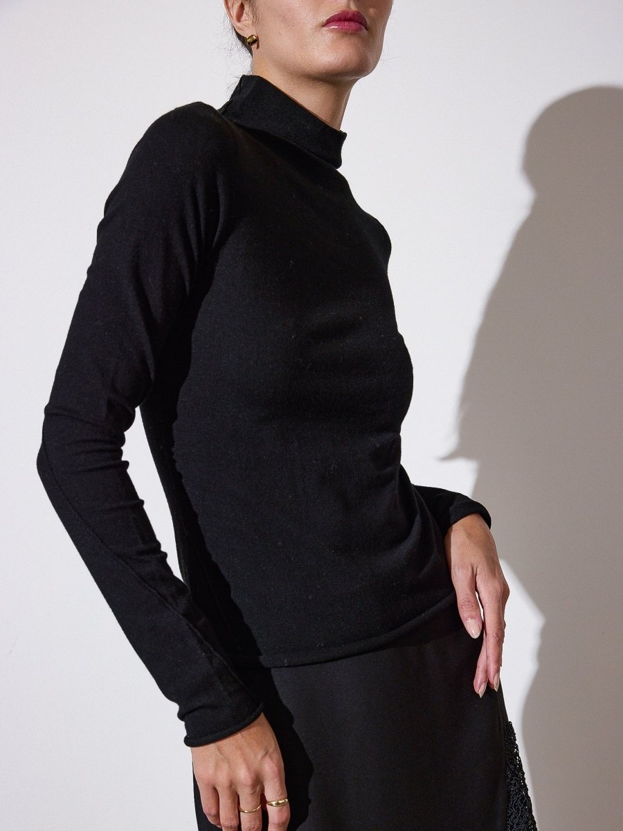 Anika black mock neck top side view