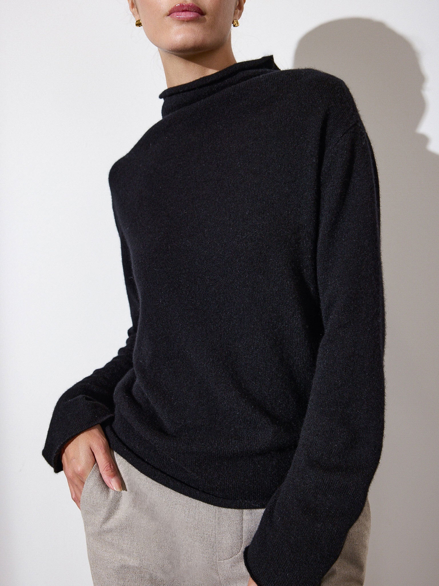Rhone funnel neck black sweater front view