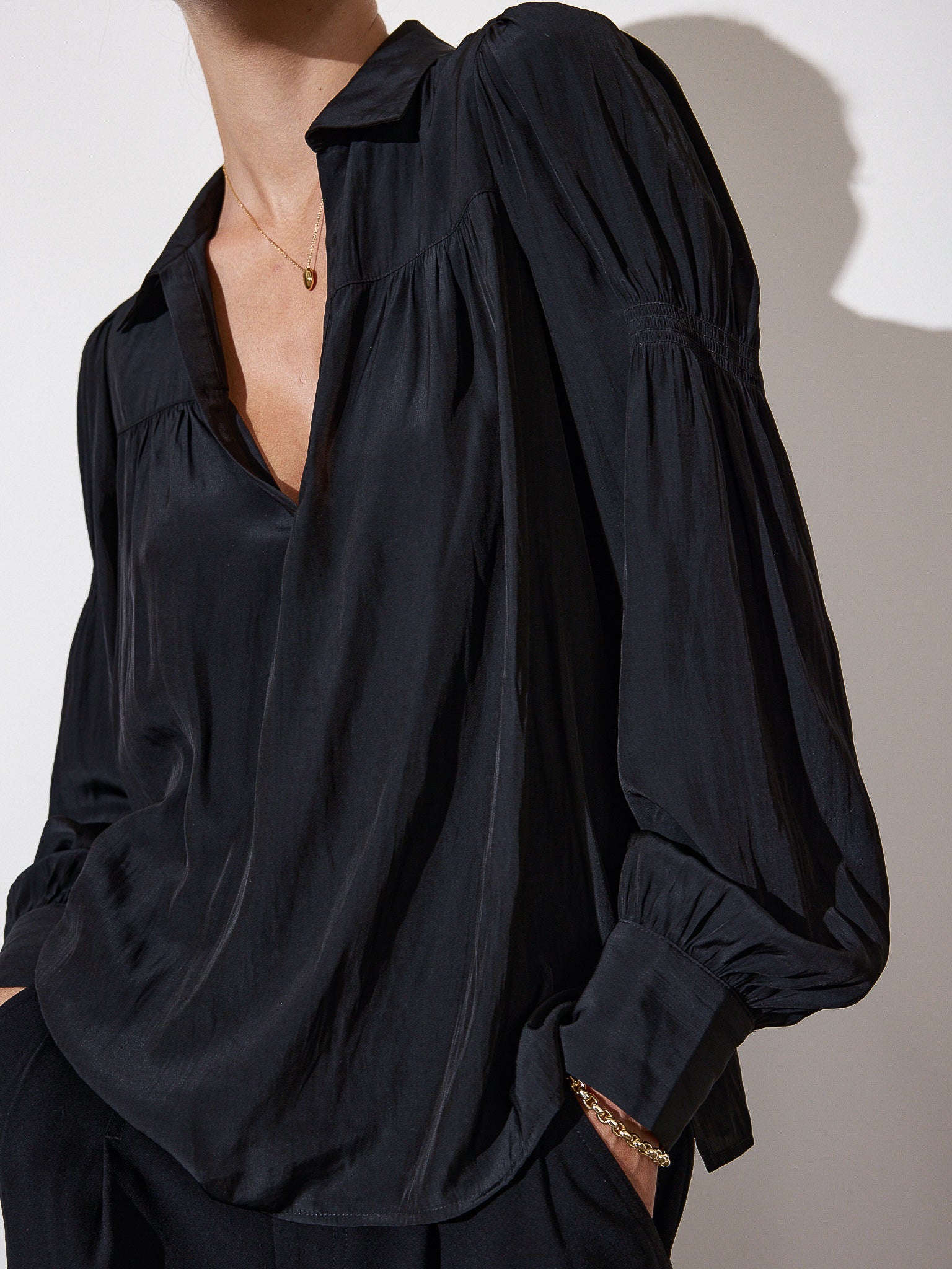 Anson black v-neck blouse side view