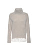Beige layered sweater with turtleneck, raglan sleeves, and white satin underlayer visible at the hem.