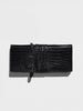 Black crocodile leather shoulder pochette with a wraparound tie strap, shown flat on a light gray background