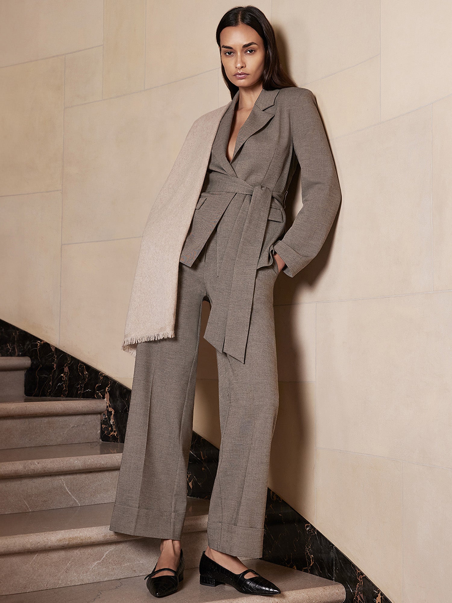 Croco-embossed black mary-jane loafers, styled with a taupe wrap blazer and wide-leg trouser suit