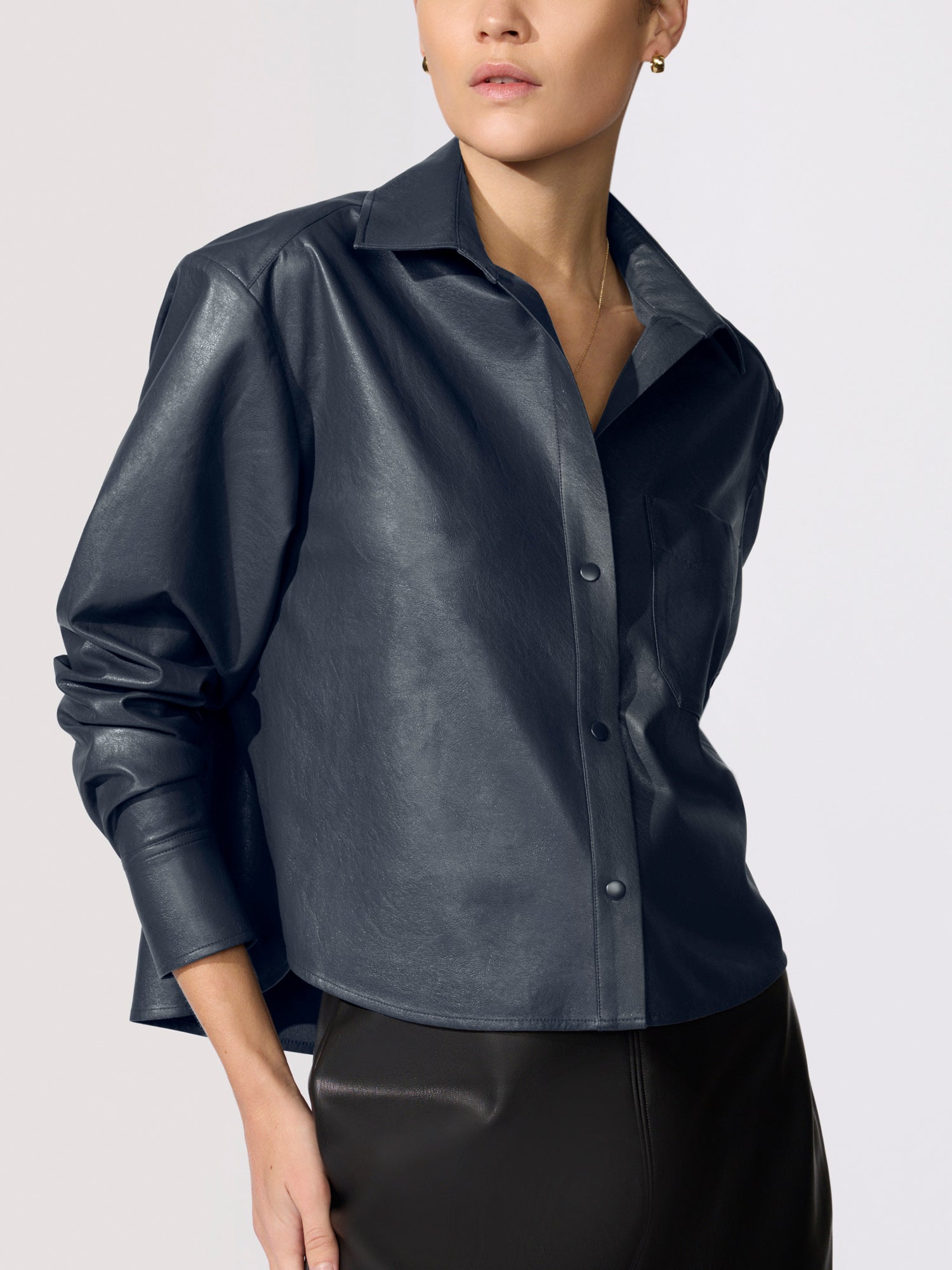 Cropped vegan leather shirt jacket in navy, close-up studio shot