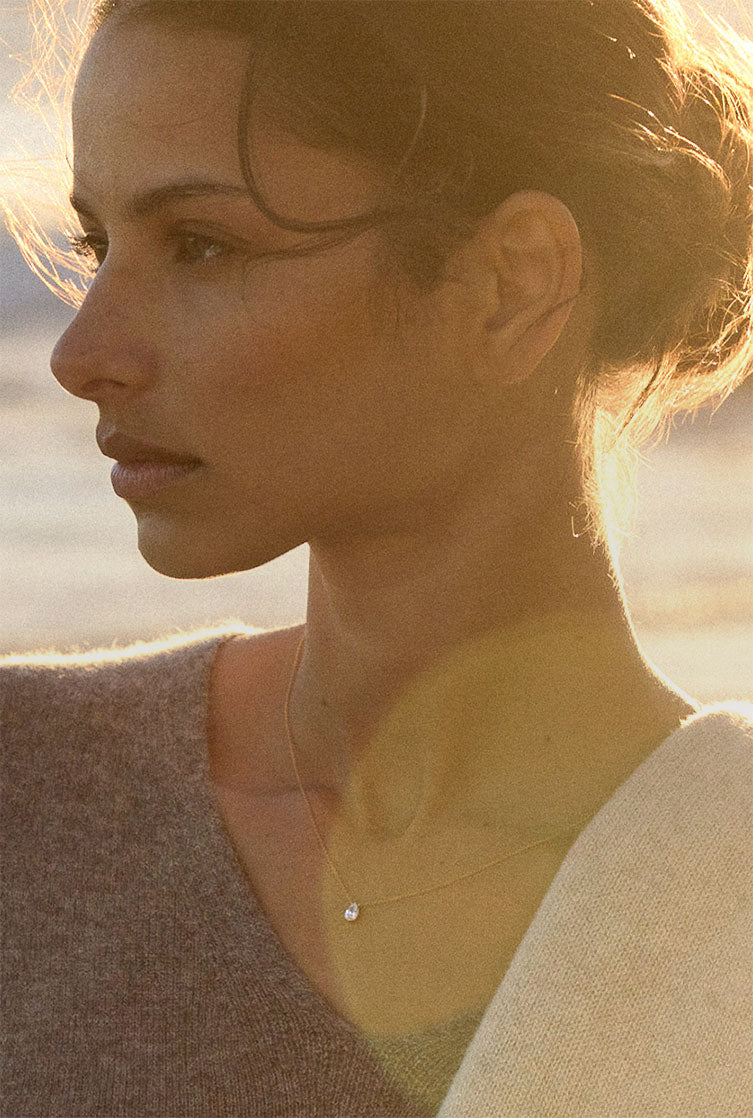 model wearing brochu walker gold and diamond pendant