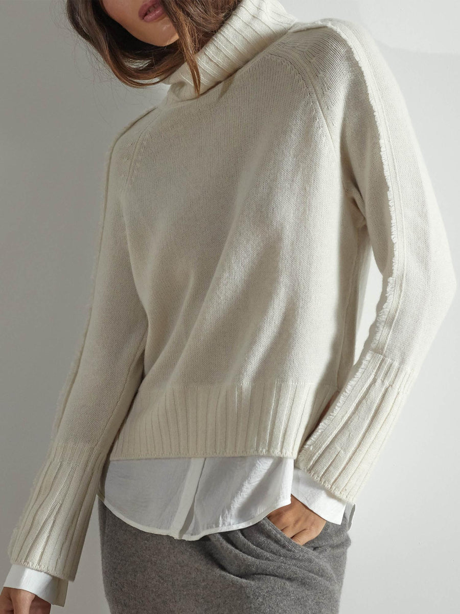 Jolie white layered turtleneck sweater standing