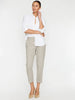 Model wearing Westport brushed pull-on pants in whisper melange beige with cuffed ankles, styled with a white shirt and tan.