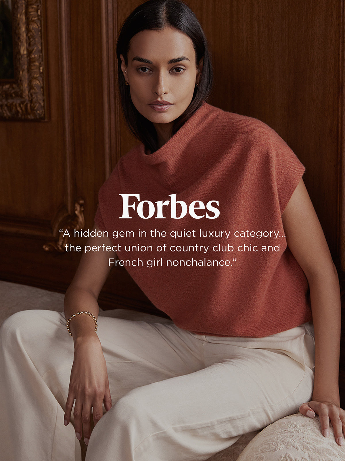 Woman wearing a terracotta cowl-neck knit top, featured in a Forbes press quote graphic