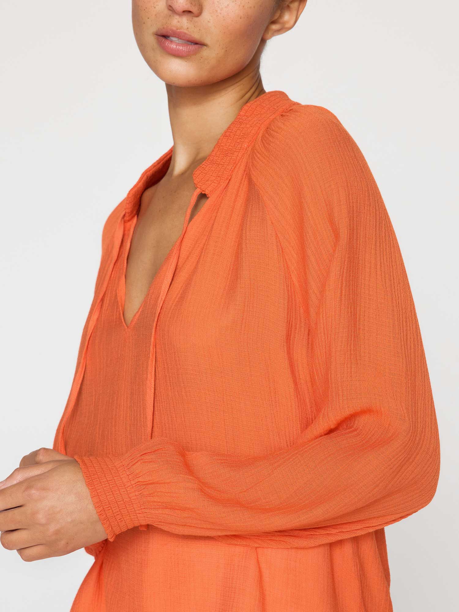 Amaia orange crepe popover blouse close up