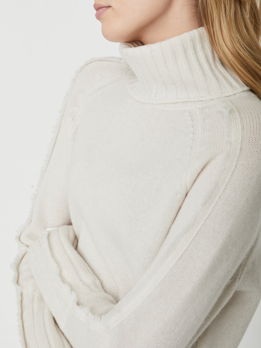 Jolie white layered turtleneck sweater close up