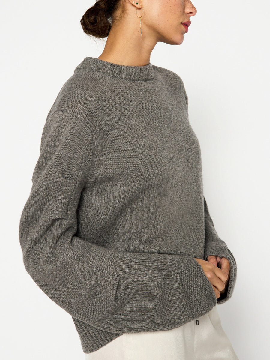Elira grey curved sleeve crewneck sweater side view