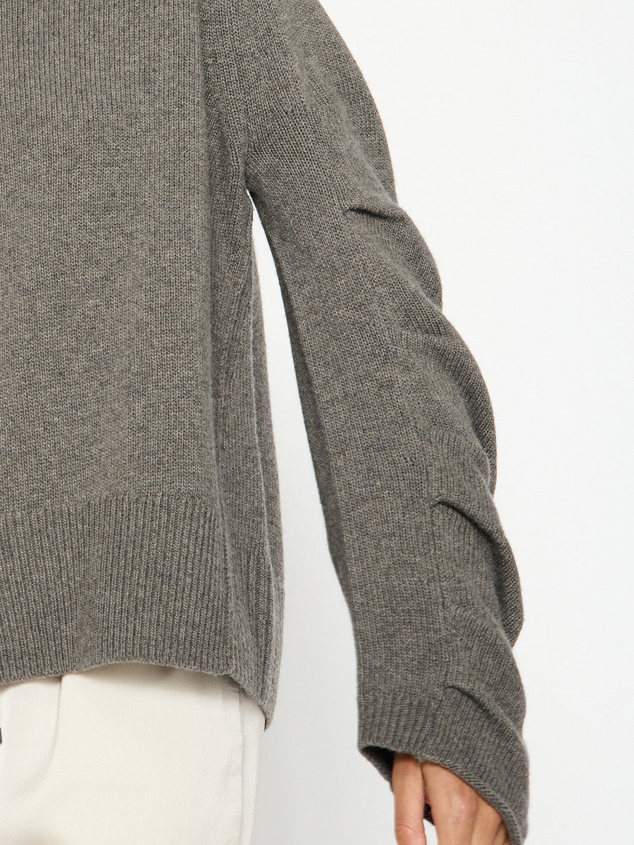 Elira grey curved sleeve crewneck sweater close up